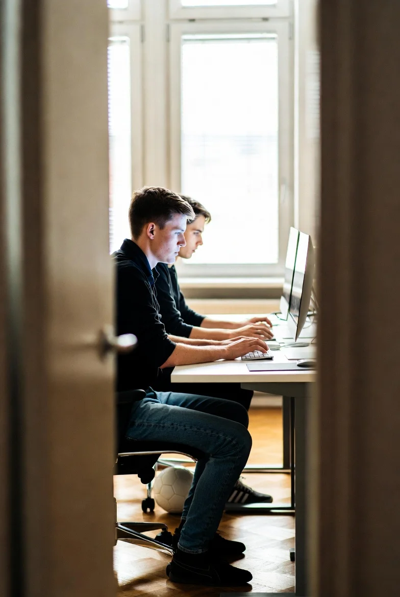 NovaTech developers pairing at a desk
